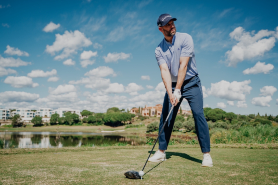 Golfer Set Up to Golf Ball With Driver