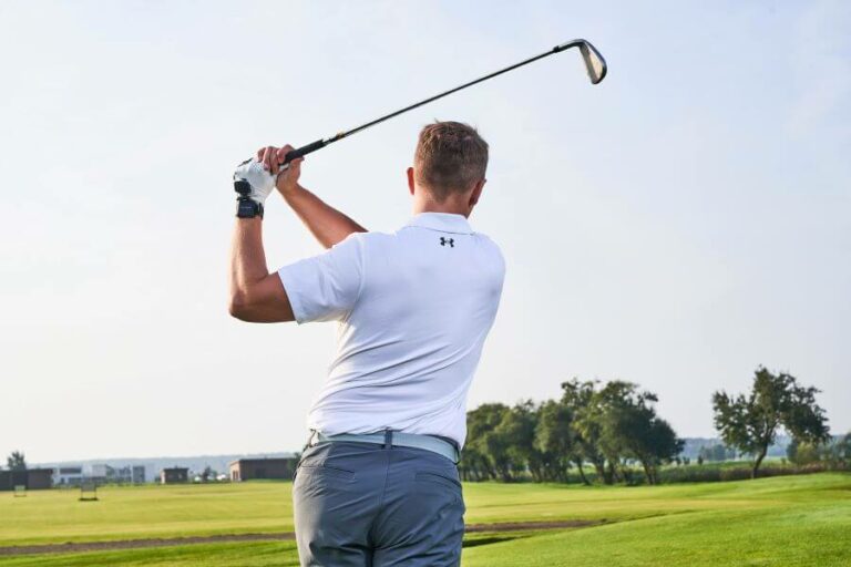 golfer on golf course after shot