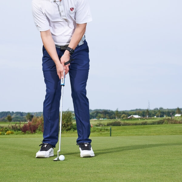 golfer on putting green training