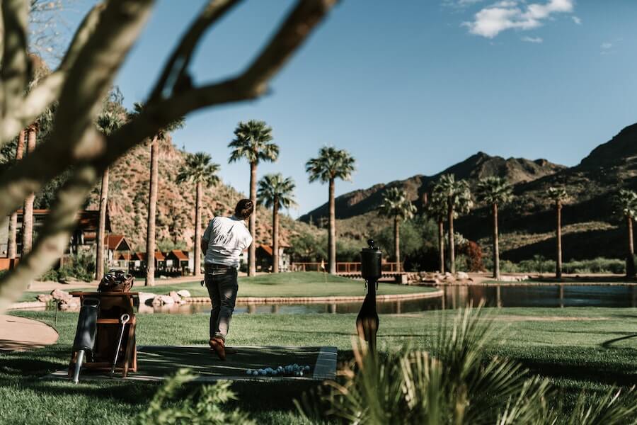 man playing golf on course
